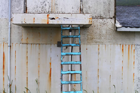 Weathered wall and blue staircaseの写真素材