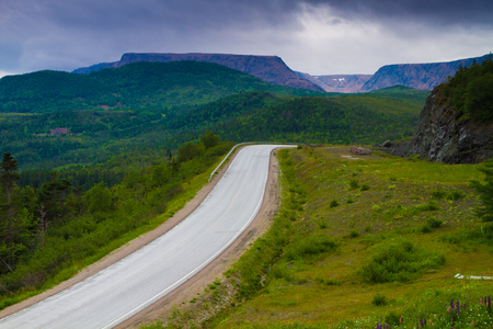 Beautiful road through mountain range in Newfoundland, Canadaの写真素材