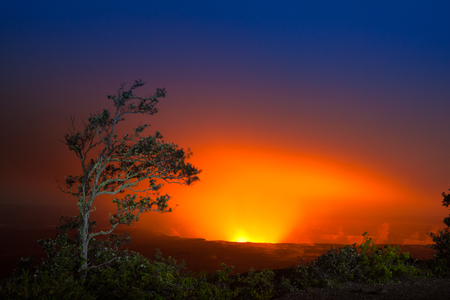 Beautiful glow from volcanic eruption at night on Big Island, Hawaiiの写真素材