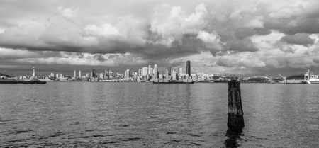 Billowing clouds hover over the Seattle skyline. Black and white image.の写真素材