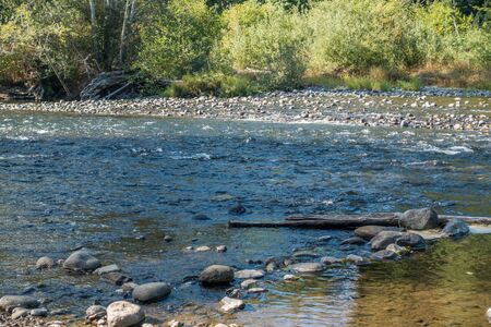 The Green River in Washington State is low revealing rocks.