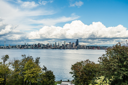 Billowing clouds hover over the Seattle skyline.の写真素材