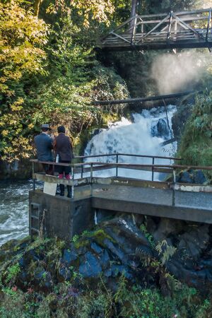 An artistic rendition of lower Tumwater Falls with onlookers.の写真素材