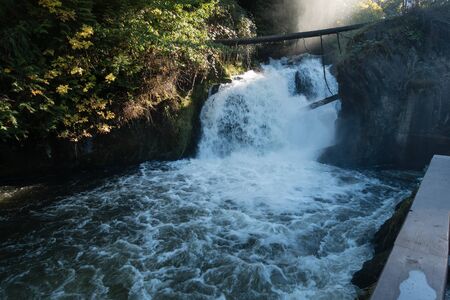 Water rushes down at lower Tumwater Falls in Washington State.の写真素材