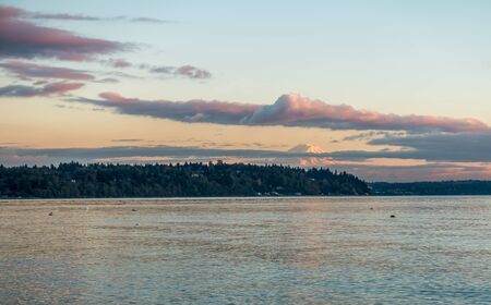 Mount Rainier at sunset as seen from Three Tree Point in Burien, Washington.の写真素材