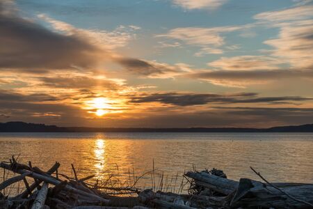 The sun sets over the Puget Sound in the Pacific Northwest.の写真素材
