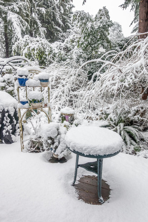 A porch is covere in white fluffy snow after a strom.の写真素材