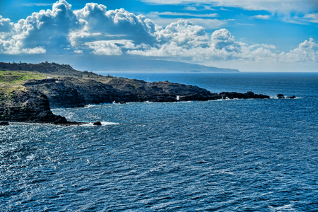 A view of the shoreline on the coast on Northwest, Maui, Hawaii.の写真素材