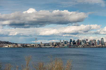 A view of the Seattle skyline with billowing clouds overhead.のeditorial素材