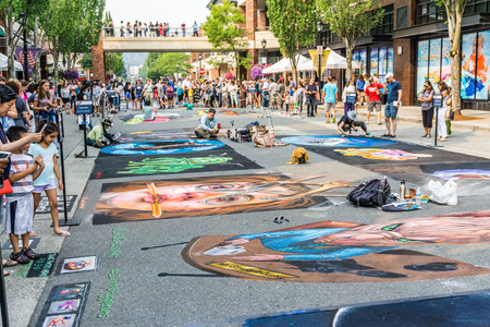 REDMOND, WA. /  USA - AUGUST 19TH 2018: Spectators enjoy art at the Chalkfest event in Redmond, Washington.The locations is Redmond Town Center.のeditorial素材