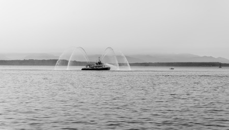 Water blasts out of this fire boat near , Washington.の素材 [FY310106969931]