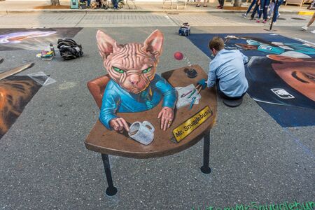 REDMOND, WA. /  USA - AUGUST 19TH 2018: An artist works at the Chalkfest event in Redmond, Washington.The location is Redmond Town Center.のeditorial素材