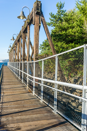 A view of a walkway along a pier at Jack Block Park in West Seattle, Washington.のeditorial素材