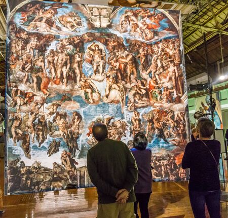 Tacoma, WA, USA - October 11, 2018        Art lovers appreciate the hangings at the Michaelangelo Sistine Chapel art exhiibt. Location is the Tacoma Armory.のeditorial素材