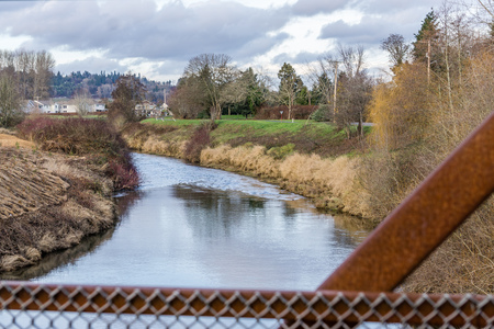 A view of the Green River and homes in Kent, Washington. It is December.