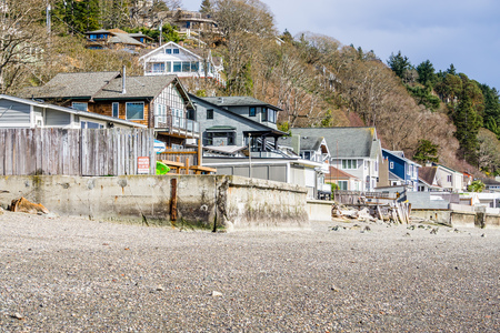 Waterfront homes face the Puget Sound in Burien, Washington. The tide is low.の写真素材