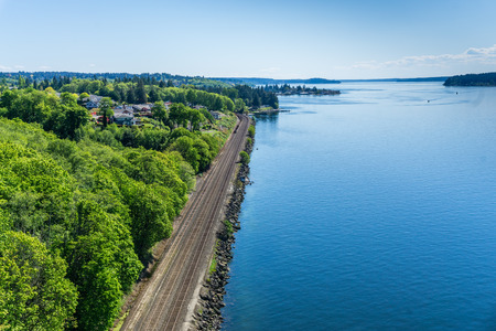 Railroad tracks along the shore of the Tacoma Narrows waterway.の写真素材