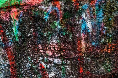 A closeup shot of bright paint on a cement wall.の写真素材