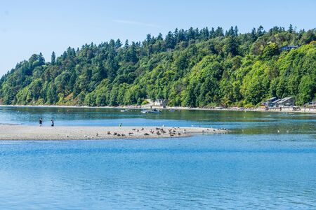 Boats are anchored near shoe in Des Moines, Washington.の写真素材