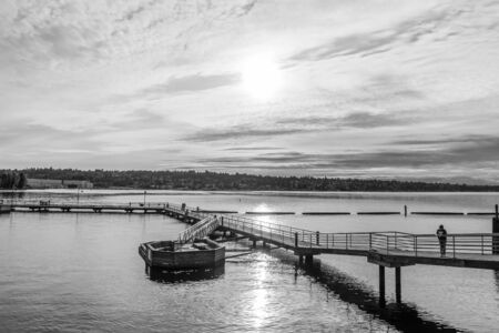 A view of the pier at Gene Coulon Park in Renton, Washington on a cloudy day.の写真素材