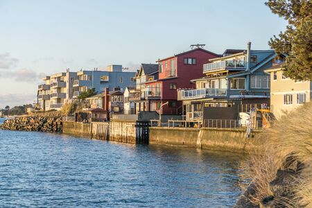 These homes are as close to the water as possible in West Seattle, Washington.の写真素材