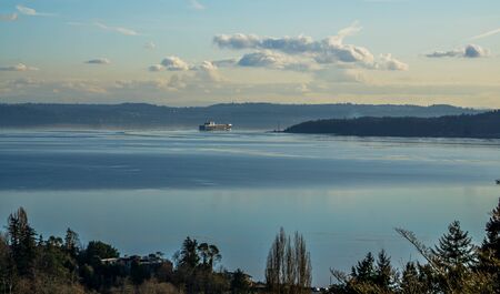 A ship moves acroos the Puget Sound on smoothe water.の写真素材
