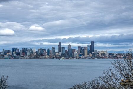Dark storm clouds hover over the Seattle skyline.の写真素材