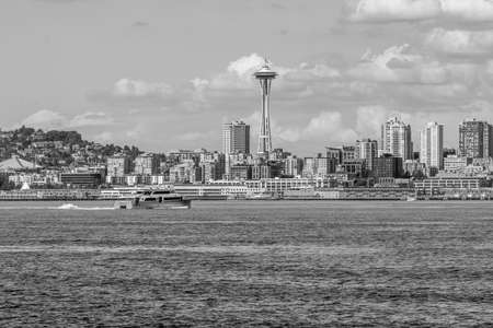 A water taxi cruises toware the skyline in Seattle, Washington.