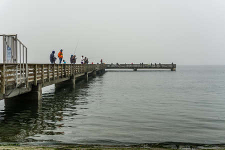 Smoke from wildfires blankets the pier at Dash Point, Washington.