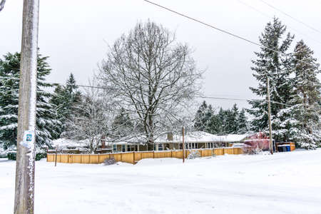 A home in buien, Washington is surrounded by snow.の写真素材