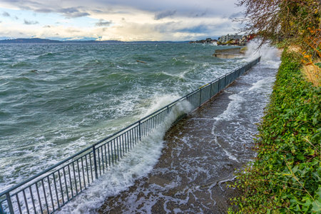 The sea assails the shoreline in West Seattle, Washington.の写真素材