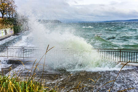 The sea assails the shoreline in West Seattle, Washington.の写真素材