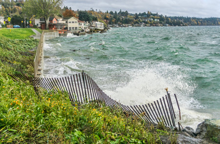 The sea assails the shoreline in West Seattle, Washington.の写真素材