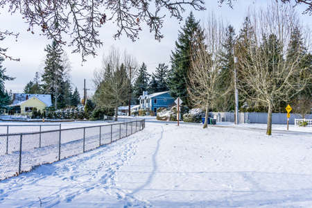 A blanket of snow lines a street in Burien, Washington.の写真素材
