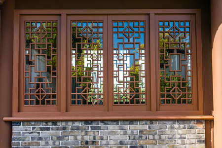 Latice work on a window in a Chinese garden in South Seattle, Washington.のeditorial素材