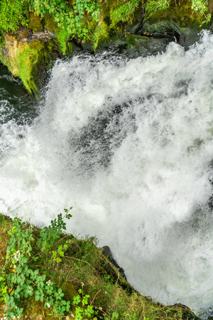 Whitewater blast through rocks at Tuimwater Falls in Washington State.の写真素材
