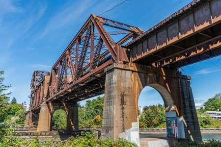 A view of an old rusty train trestle at the Lock in Ballard, Washington.の写真素材