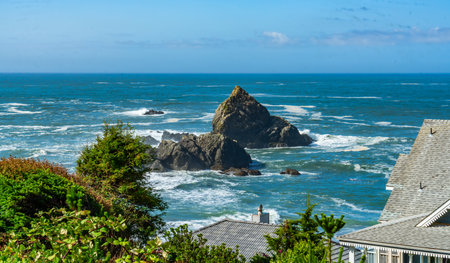 A view of the sea and rock formations from the front yard of a home in Brookings, Oregon.の写真素材