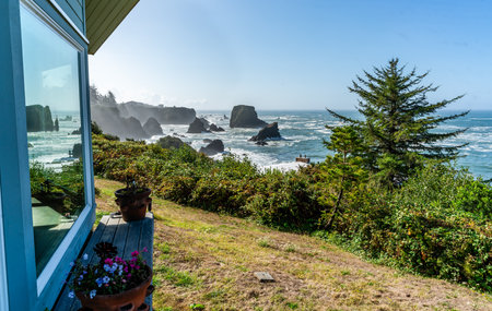 A view of the sea and rock formations from the front yard of a home in Brookings, Oregon.の写真素材