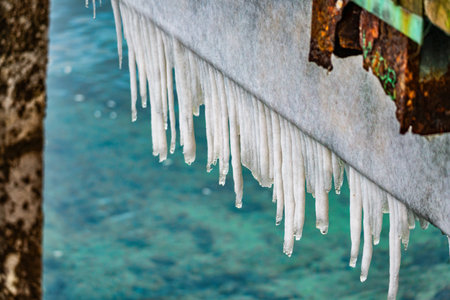 A close-up shote of icicles hanging from a pier in Ruston, Washingotn.の写真素材