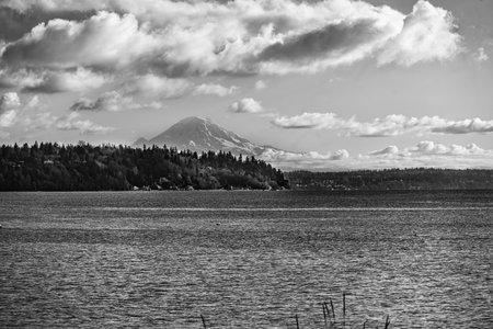 A view of Mount Rainier with the Puget Sound in the foreground. Location is Burien, Washington.