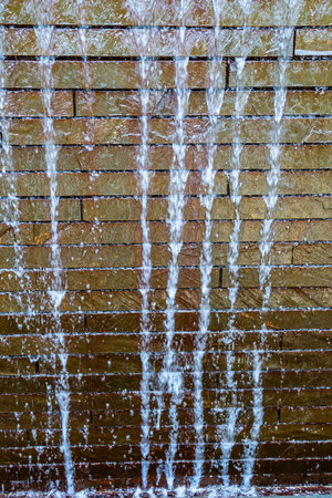 A close-up shot of a wall fountain at a garden in Bellevue, Washington.の写真素材