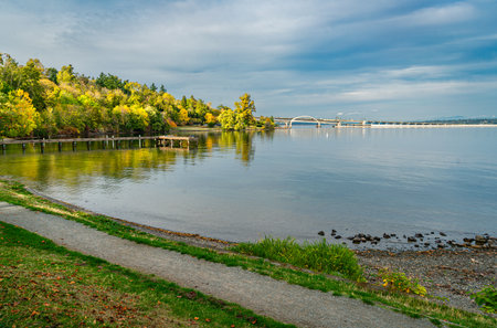 A pier and shoreline autumn colors at Lake Washington in Seattle.