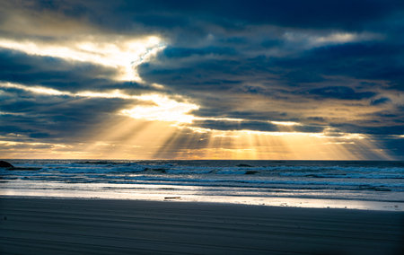 Rays of light shing through clouds at Long Beach, Washington.