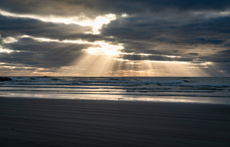 Rays of light shing through clouds at Long Beach, Washington.