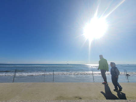 Walking by the beachの写真素材