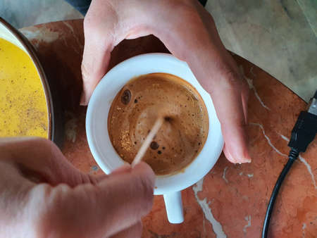 Enjoying my espresso coffeeの写真素材