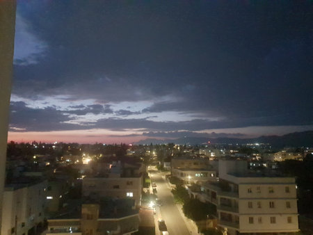 Night view from the window of a modern residential building in the cityの写真素材