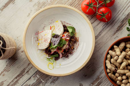 Caucasian Eastern European cuisine. Georgian restaurant salad. The photograph lay flat on the tableの写真素材