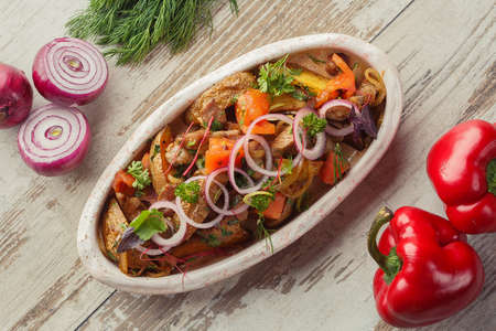 Georgian dish on the table photo for the menu of Eastern Caucasian cuisine. Grilled vegetables